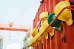 yellow and green hard hat on rack